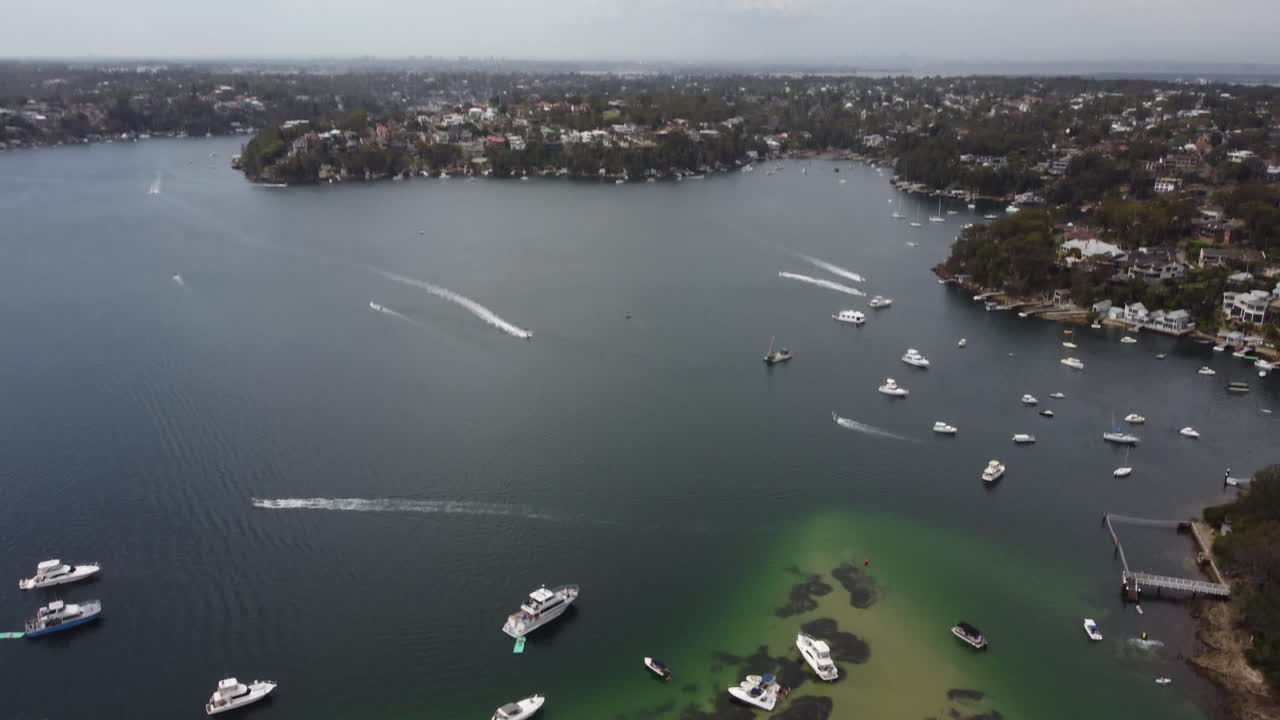 Reveal shot of the city from above the river.