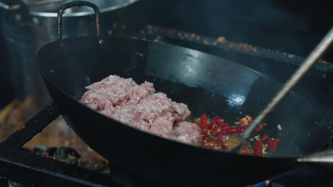 Cooking pork in a wok