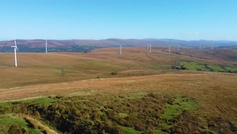 aerial view of a wind farm on rolling hills