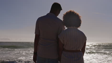 back, love and a couple holding hands on the beach
