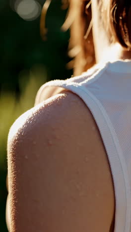 close-up of sweat drops on a person's shoulder during exercise