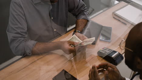 business transaction with protective barrier