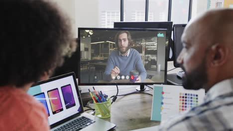 African-american-business-people-on-video-call-with-caucasian-male-colleague-on-screen