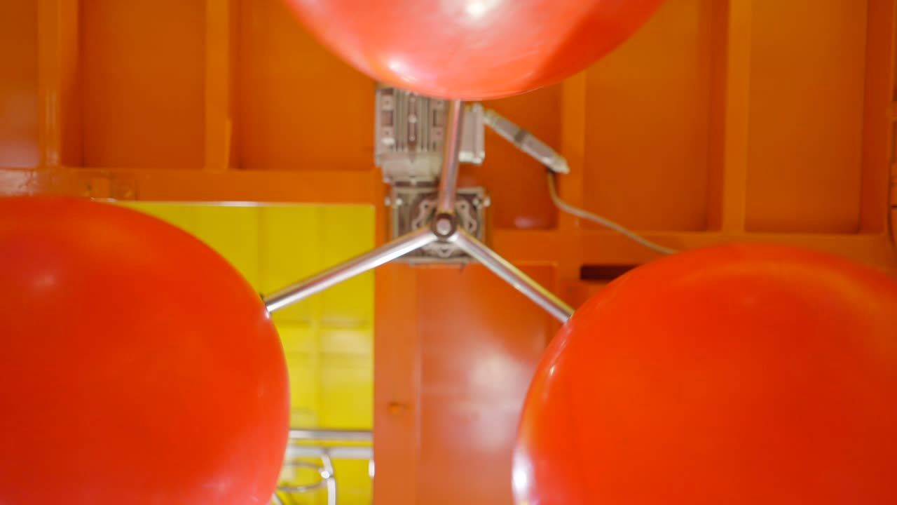 Interactive Science Exhibit with Red Balls and Motor