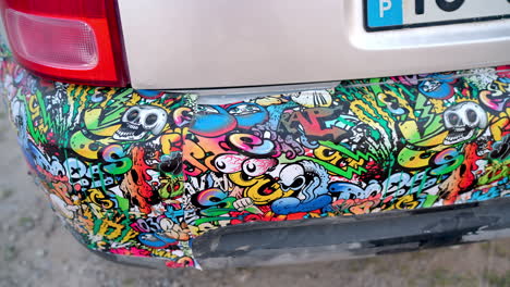 car bumper showcasing vibrant, colorful graffiti stickers