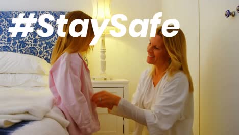 animation of stay safe text over mother and daughter at home