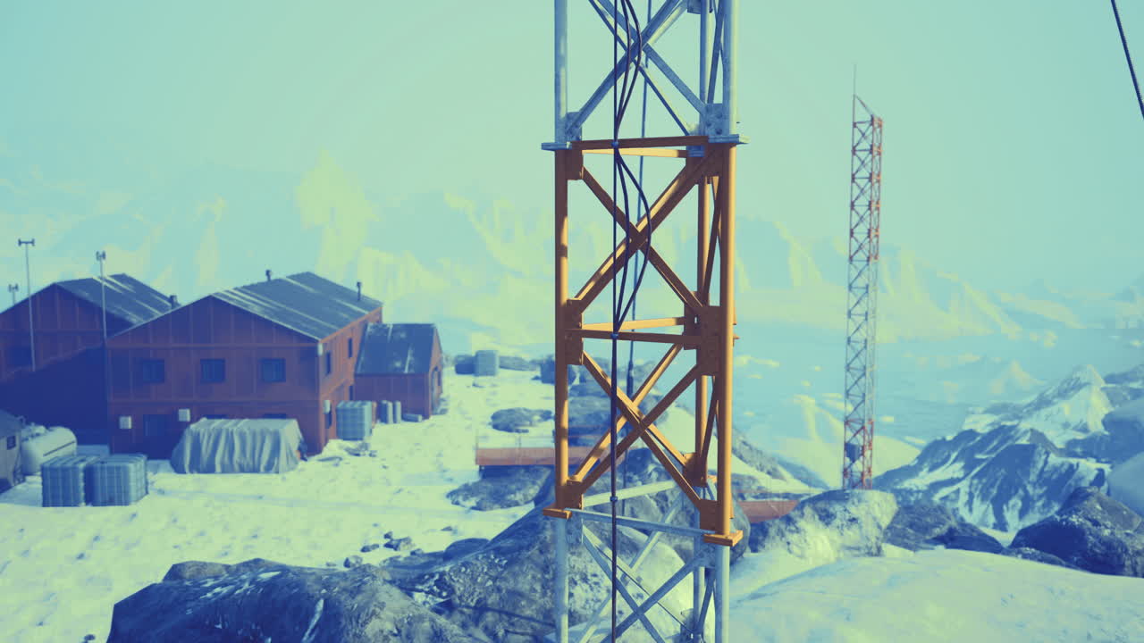 Communication towers stand tall at a remote snowy mountain station