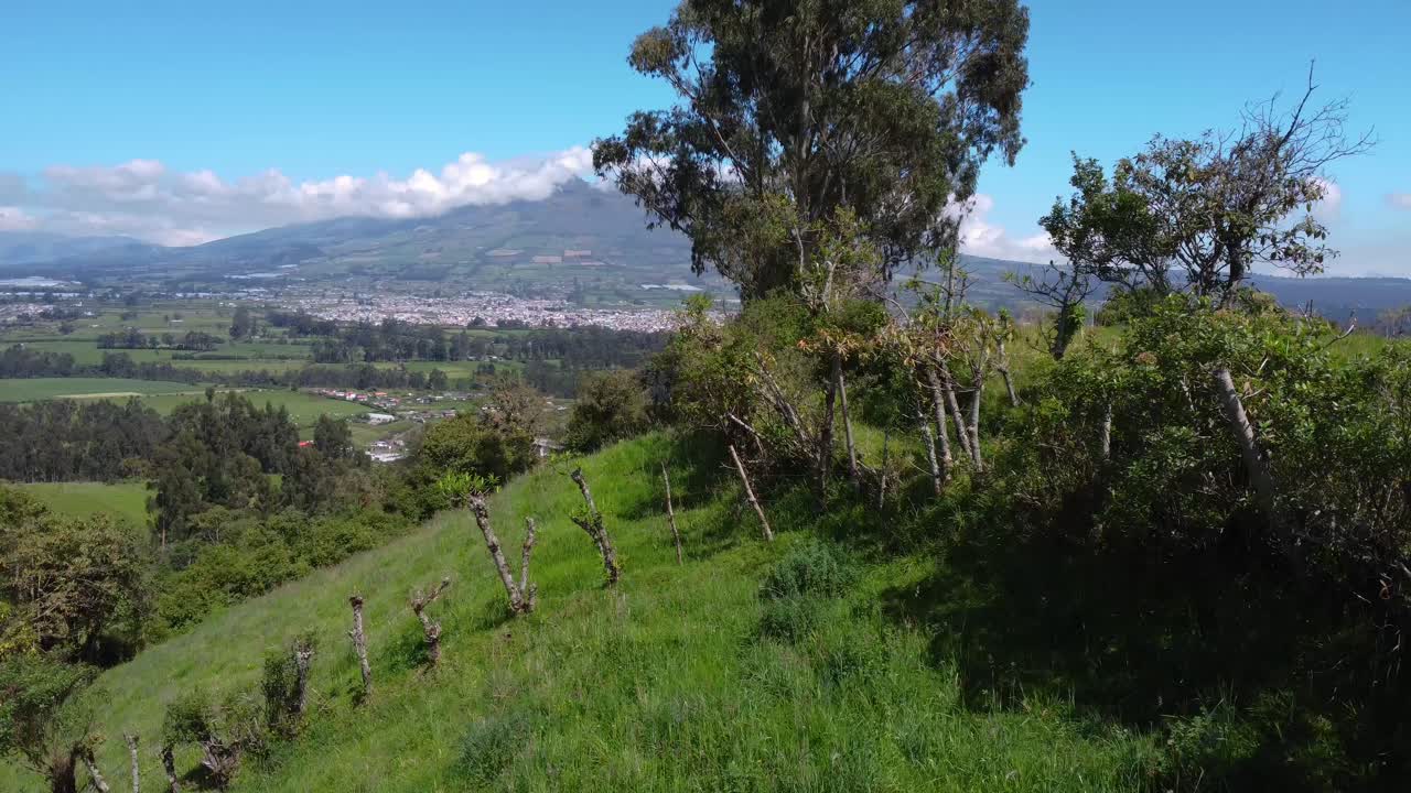 Dolly drone shot, greenland province of Pichincha, Ecuador with view on the corazón volcano on a sunny day, copy space