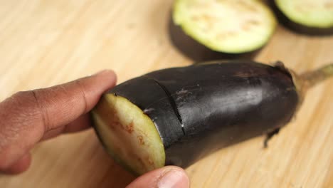 cutting an eggplant