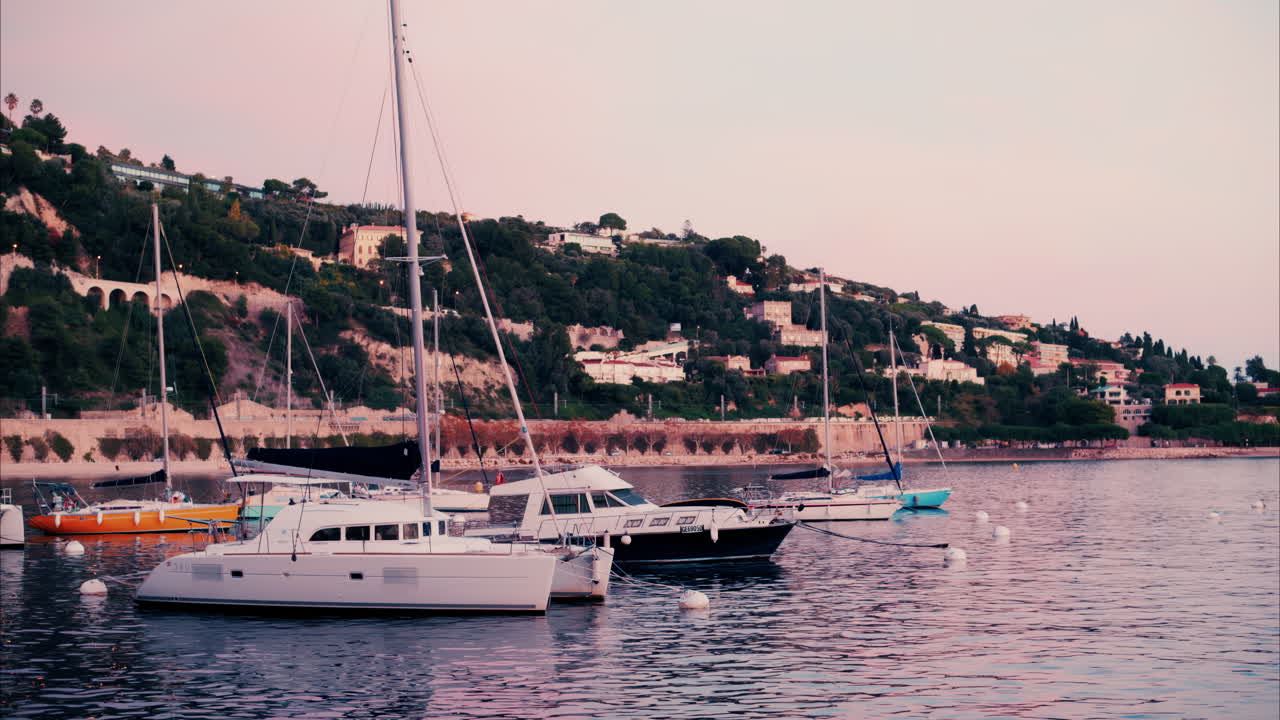 Villefranche Sur Mer, France - December 8, 2024: Boats docked in the Port de Villefranche-sur-Mer in the evening