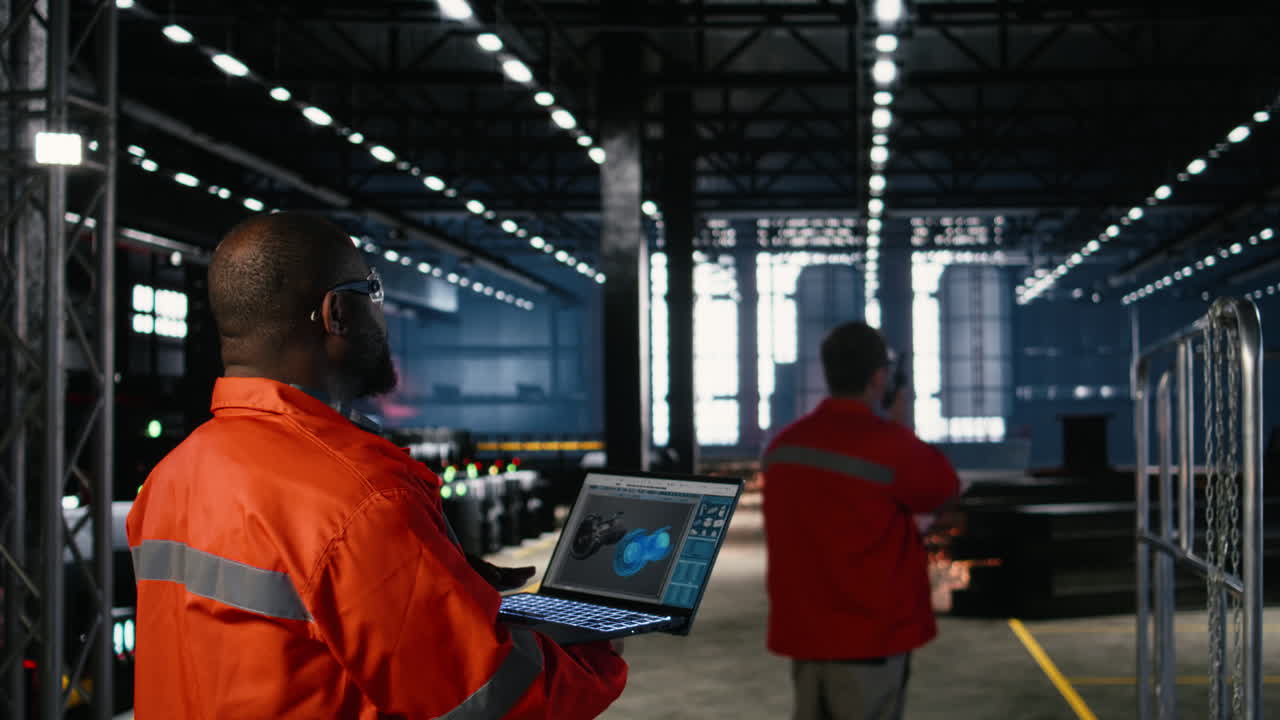 Engineer inspects turbine in industry plant and operating software on laptop