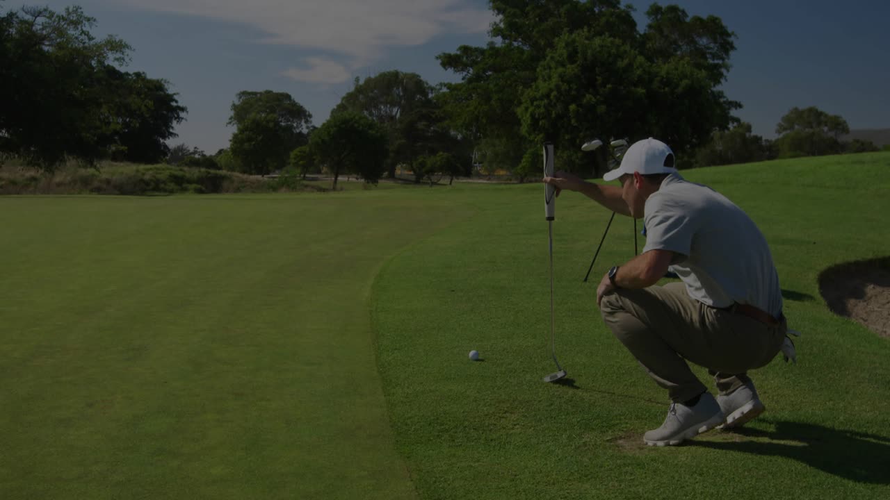 Golfer squatting behind ball aligning putter and initiating analytics charts for golf tech analysis