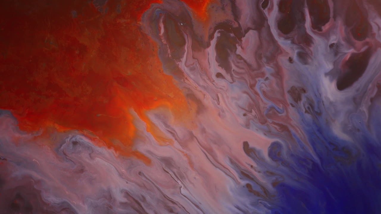 Meerkleurige laag inkten die zich verspreidt en een abstracte achtergrond creëert