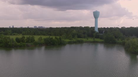 brays bayou and large water tower in alief texas – 4k aerial footage