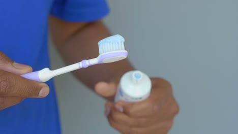 man brushing his teeth