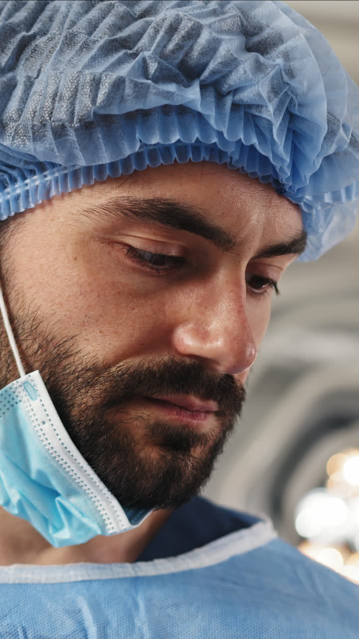 Surgeon in operating room vertical video