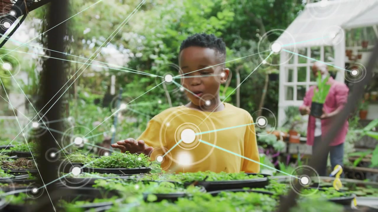 Boy walking to benches, activating nodes clustering around hand while touching sprouts for learning