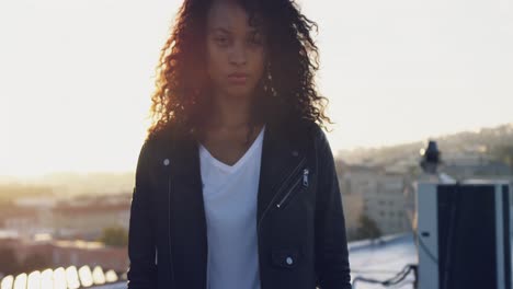 fashionable young woman on urban rooftop