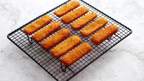 Rows-of-golden-fried-fresh-fish-fingers-fillets