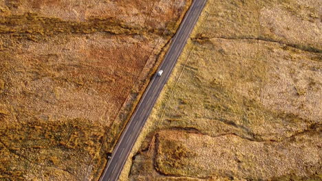 Drone-shot-of-the-West-Yorkshire-moorland-and-roads-with-the-sunsetting-casting-golden-sun-on-the-hills