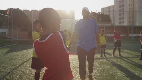 soccer kids exercising in a sunny day