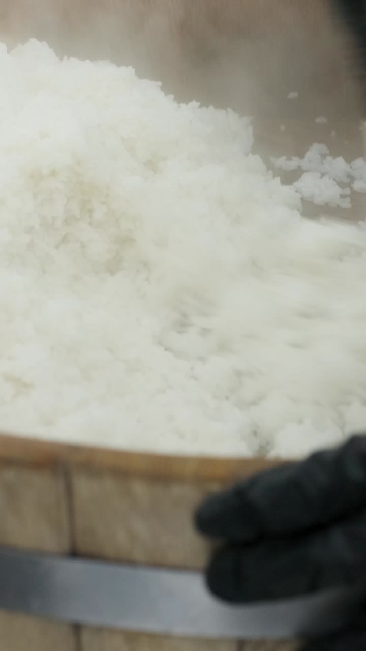 Steaming rice in a large container