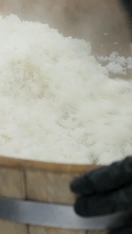steaming rice in a large container