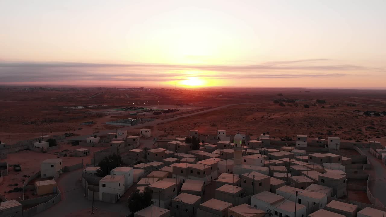 aerial shot of sunrise in an old empty city in the desert in palestine near Gaza.