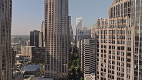 charlotte north carolina aerial v182 low flyover tryon street through city center capturing downtown cityscape with towering skyscrapers along the street - shot with mavic 3 pro cine - oct 2st 2023
