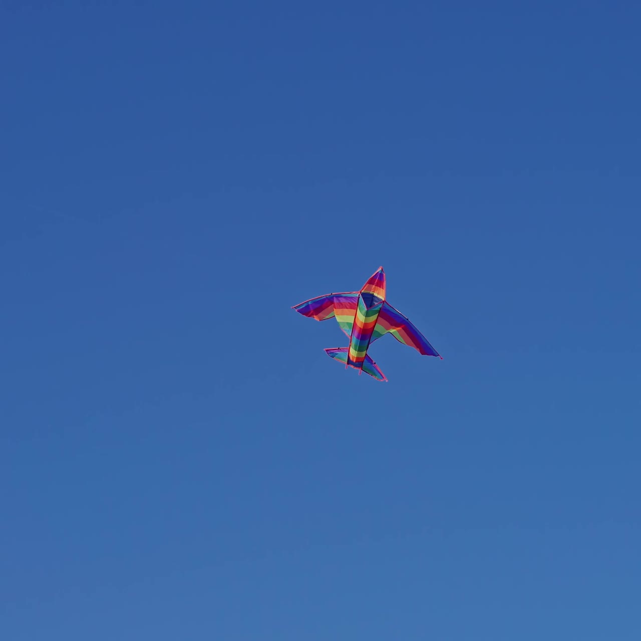Bright kite flying in sky