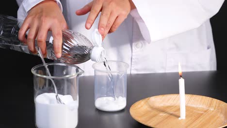 a scientist demonstrates a chemical reaction using baking soda, vinegar, and a candle in a laboratory setting