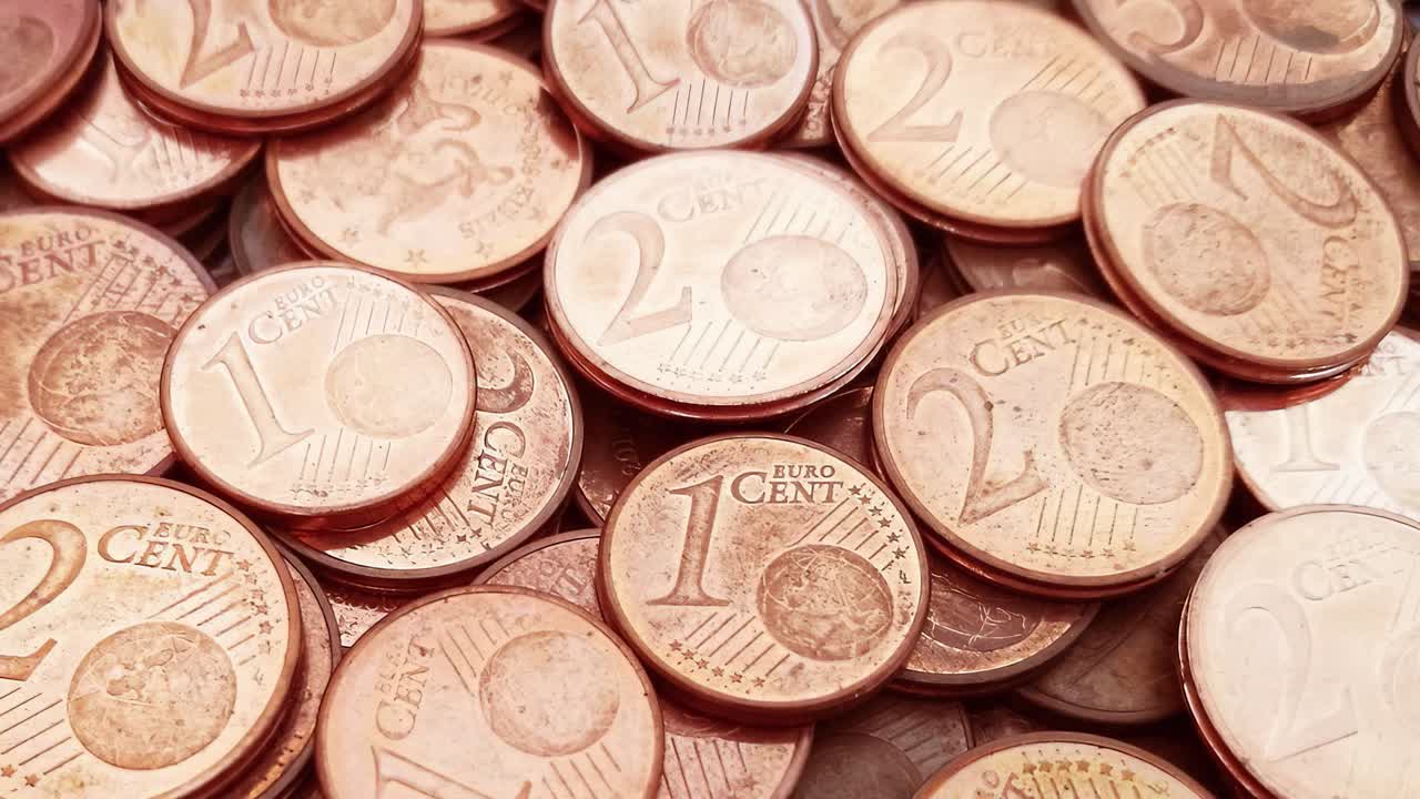 Pile of 1 and 2 cents coins close up