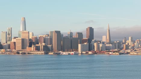 slow aerial drone zoom in of downtown san francisco, california showing the iconic embarcadero. shot in 4k.
