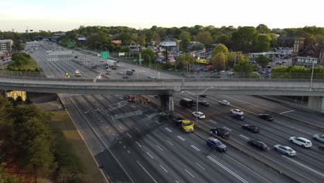 drone shot pulling out from the scene of a car accident blocking off interstate traffic in atlanta, georgia on april 6th, 2024