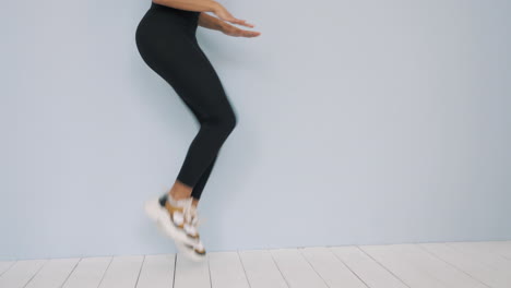 woman performing jumping jacks