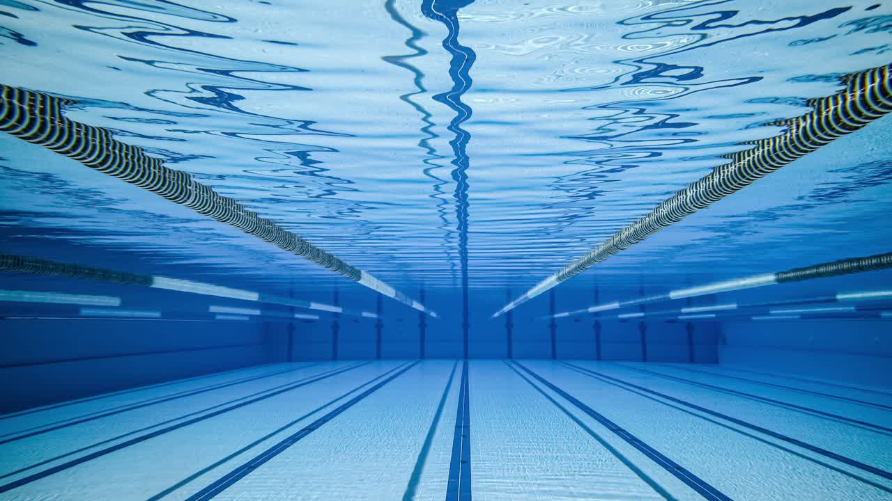Olympic Swimming pool under water background.