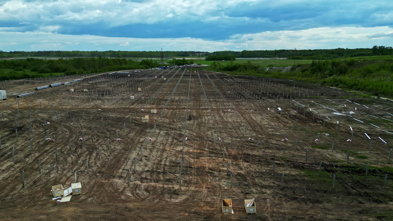 Construction site with cleared land for future development under a cloudy sky