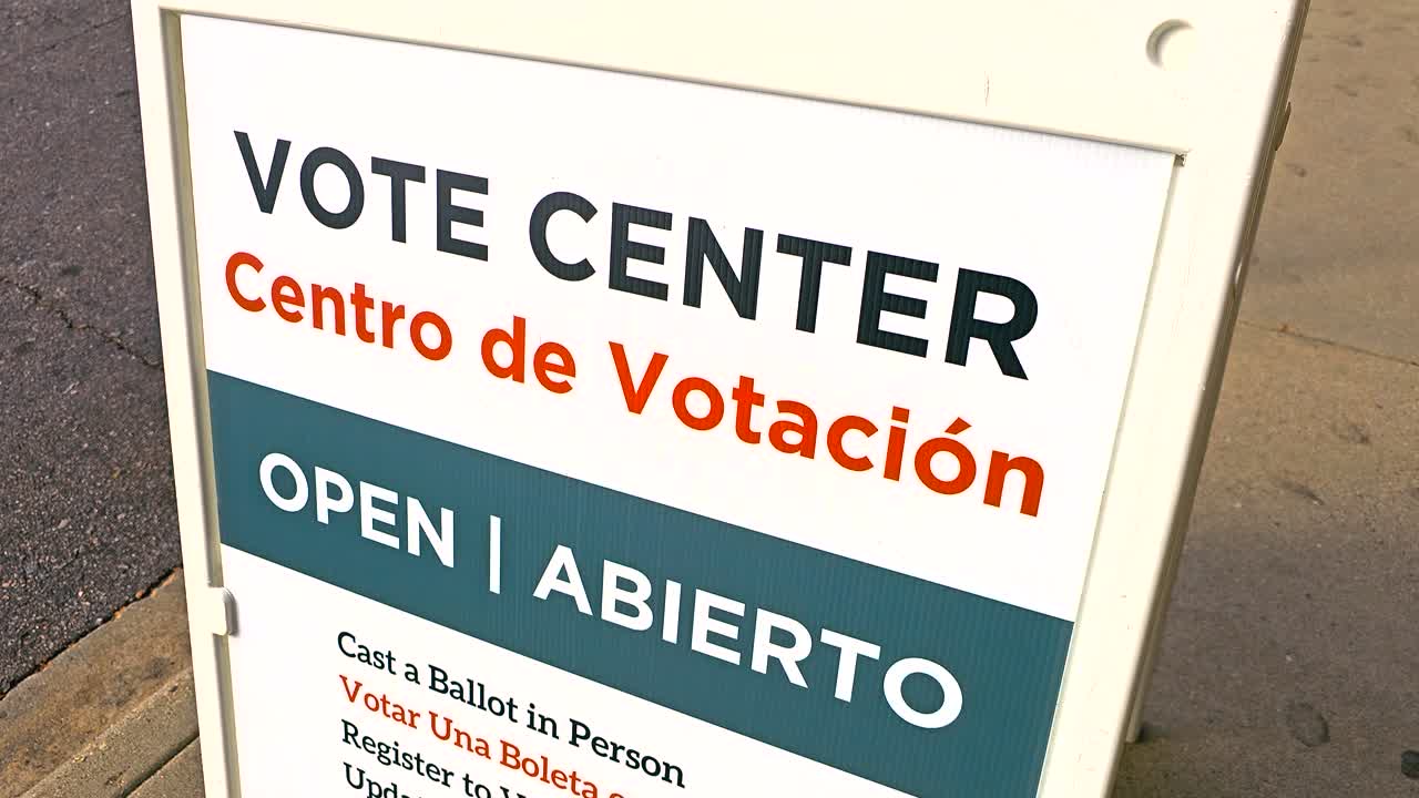 Election stock footage of “Vote Center, Centro de Votación – Open, Abierto” with Spanish translation, promoting inclusivity, voter registration, in-person voting, and mail ballot access