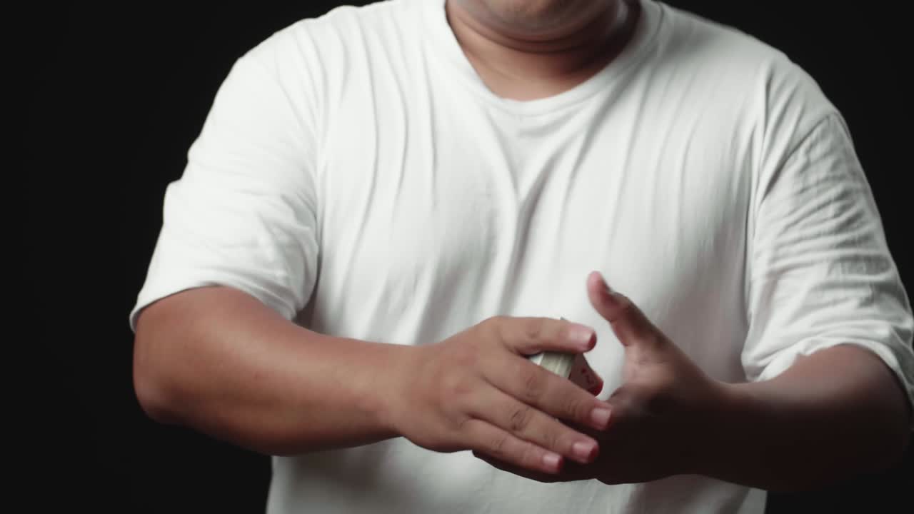 Magician Does Card Trick Throwing Deck From One Hand To Another. Slow Motion