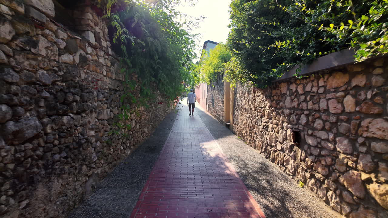 Man walking on the beautiful, narrow streets of Beaulieu-sur-Mer, France