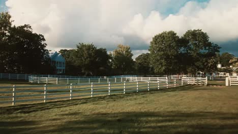 green fields leading to american farmhouse property