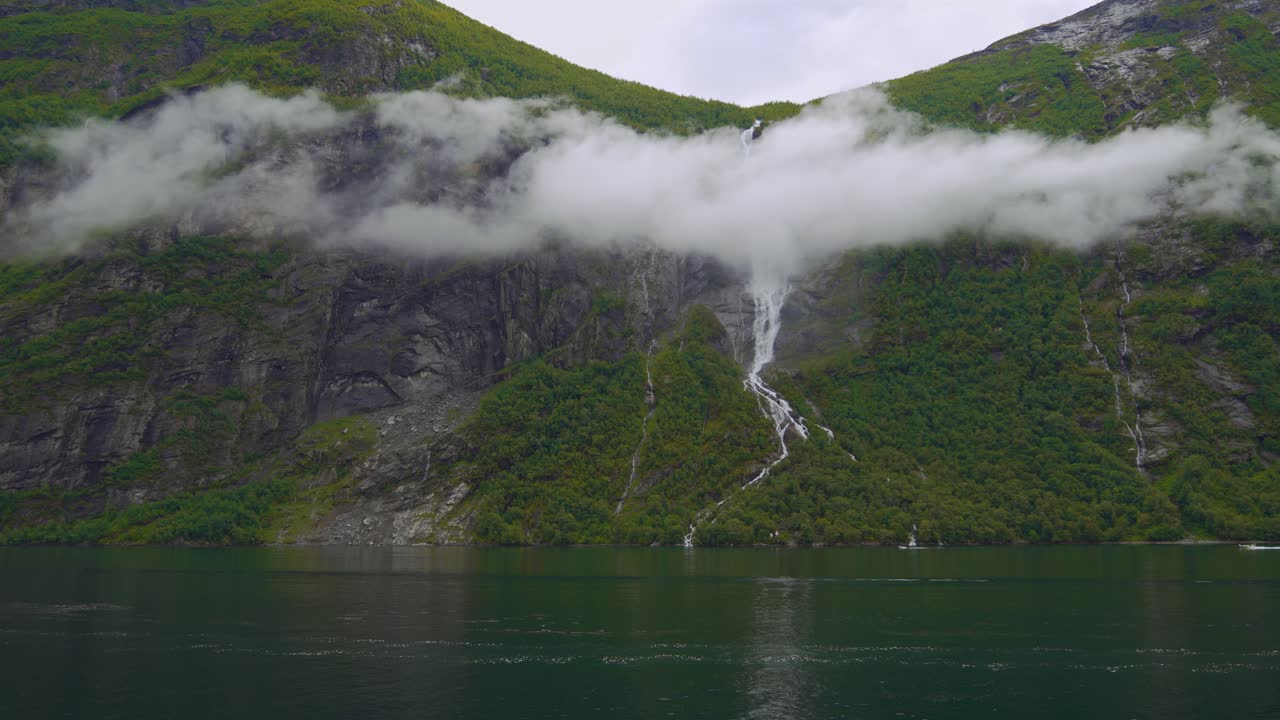 Geiranger Fjord, Norway. Epic scenic Scandinavia nature with waterfall and sea landscape.