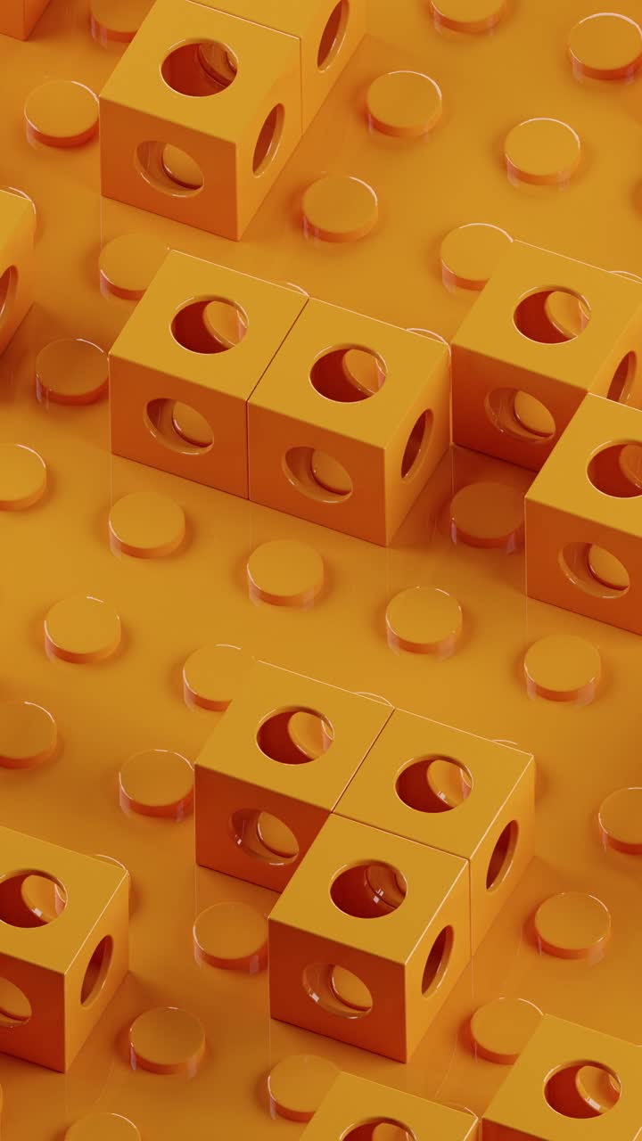 los cubos naranjas con agujeros giran y se mueven. vídeo en bucle vertical