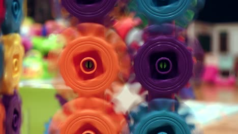 kids toy colored spinning gears, close up