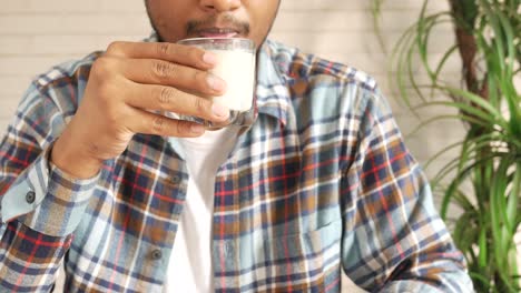 man drinking milk