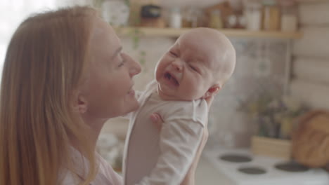 mother and baby in kitchen