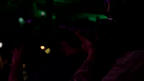 flashy paparazzi journalists clicking celebs in dark