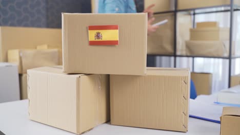 spain flag on logistic cargo package.