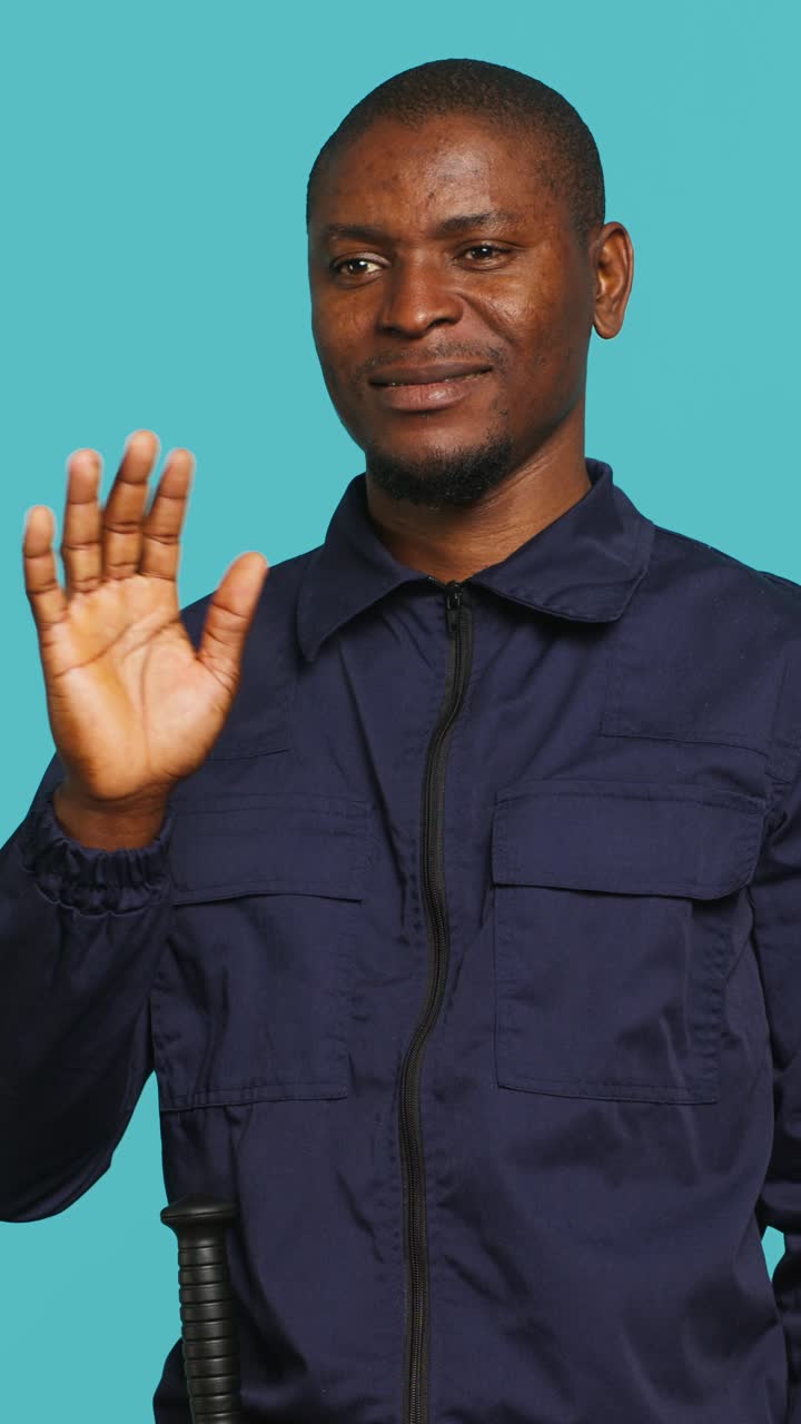 Friendly African American Security Guard Waving and Smiling