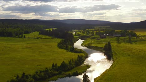 bridging nature's beauty: horse lake and river drone footage at sunset